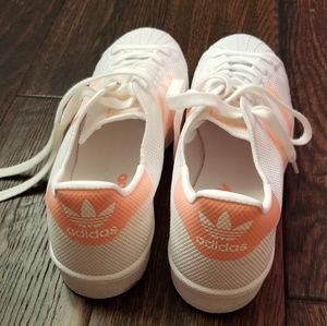 White and coral striped Adidas